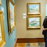 Guests admiring paintings at Friends of Alten 2018